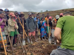 Villagers standing with shovels